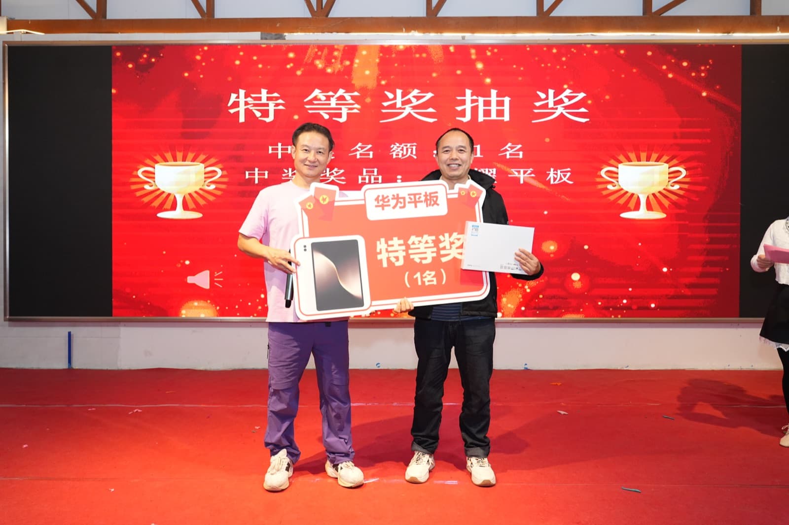 BURTONO colleagues sharing an award moment at a company gathering