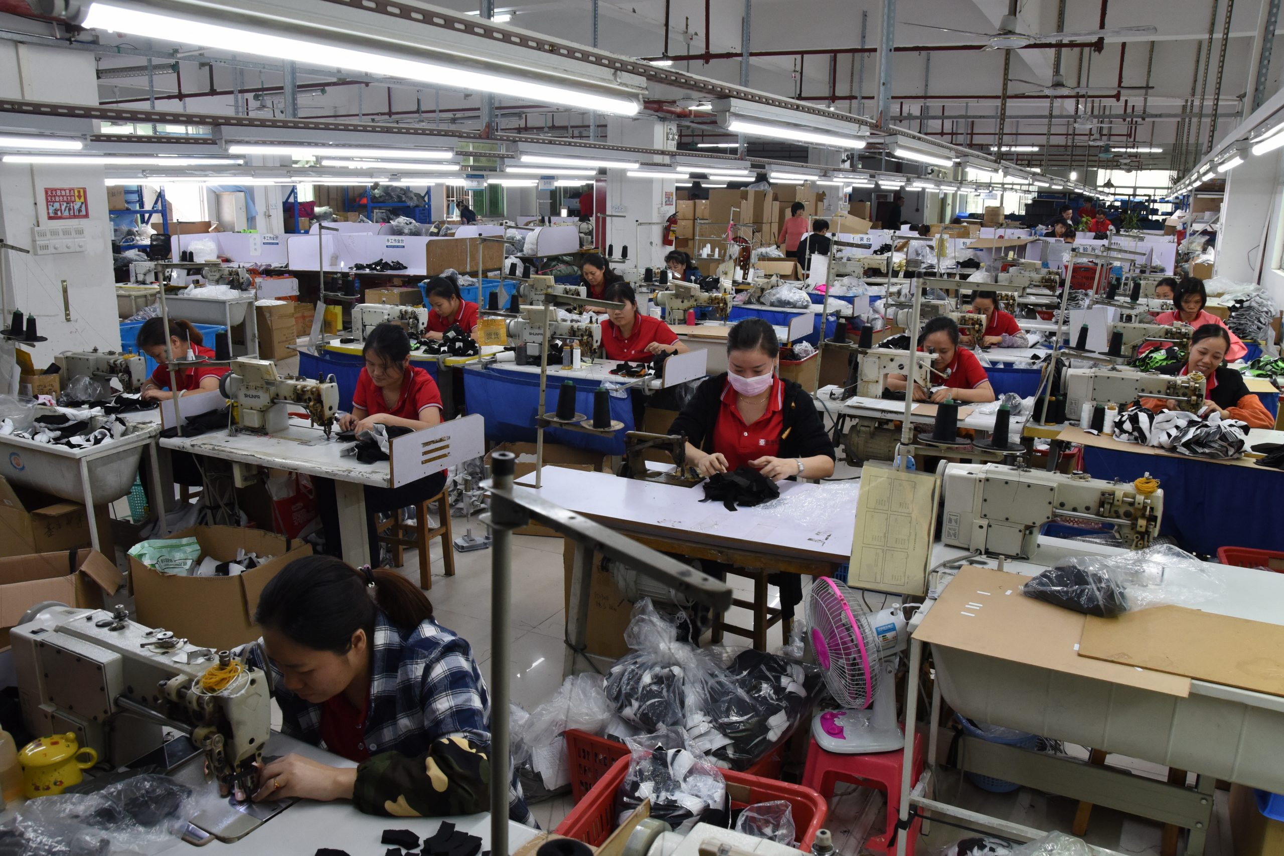 BURTONO sports glove sewing workshop with production operators and sewing machines