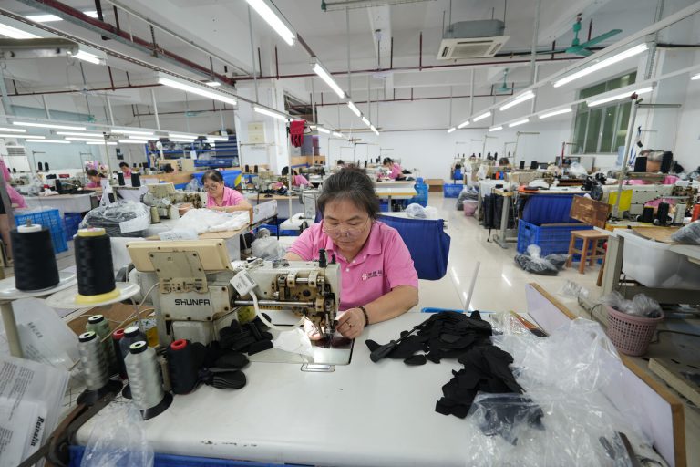 Sports glove sewing workstation at BURTONO factory